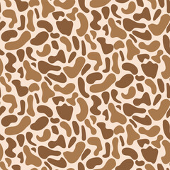 Western Americana Brown Abstract Cow Print seamless pattern on light background. For textile, fabric and wallpaper.