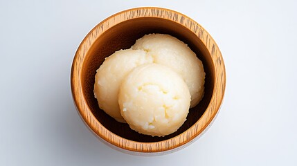 Creamy Pale Yellow Food in Rustic Wooden Bowl, Overhead View