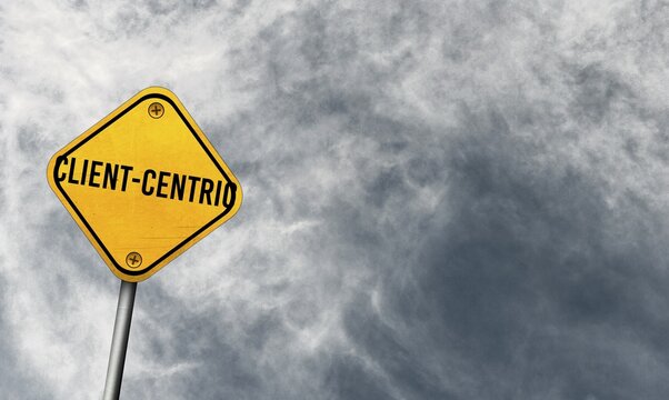 Client-centric, yellow sign with cloudy sky