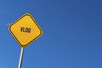 Vlog, yellow sign with blue sky