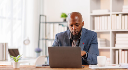 Businessman working at office with documents on his desk, doing planning analyzing the financial report, African American business plan investment, finance analysis concept