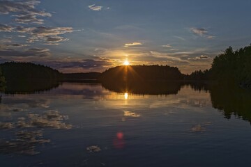 Sunset, reflection in the lake, Linnansaari, Finland, Europe