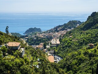 Fototapeta premium Townscape with Naxos Bay, Taormina, Sicily, Italy, Europe