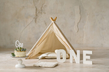 Birthday cake with word one on the topper