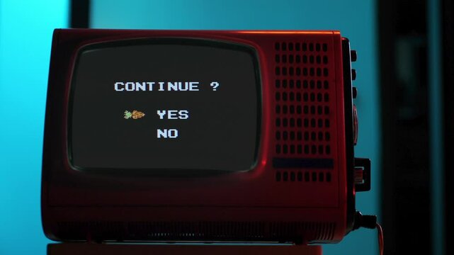 Retro red television displaying continue screen with yes no options. 8 bit console