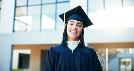 Happy, woman and portrait at graduation outdoor, education achievement and qualification ceremony....