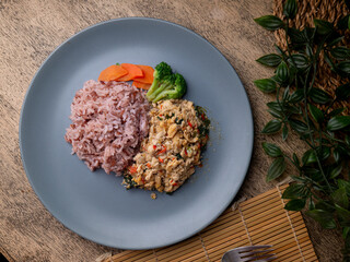 Jasmine Red Cargo Rice with Stir-Fried Basil Chicken. Pad-kaprao, Thai food.