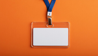 Blank office badge, empty name tag on orange backdrop. Mock-up.