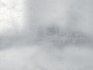 Abstract background in soft pastel gray tones.