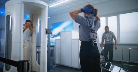 Airport Terminal: Woman Walks Through Metal Detector Gates on Security Checkpoint. Female Security Officer Inspects Passenger, Documents, Ticket for Plane Flight. Diverse Tourists Going on Vacations.
