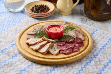 Rustic Meat Assortment with Veal Tongue on Wooden Platter – Warm, Inviting Lighting and Natural Composition