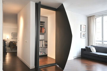Intriguing space door design opens into modern apartment with sleek architecture