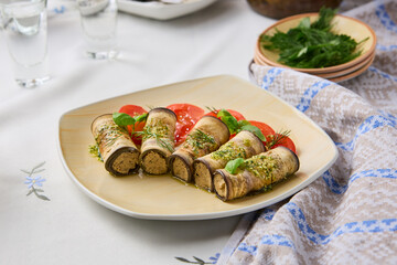 Elegant Eggplant and Cheese Rolls on Rustic Table Setting with Light Pastel Colors