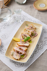 Gourmet Smoked Mackerel Slices on Elegant Table Setting with Natural Lighting