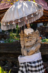 Traditional house decorations in Bali, Indonesia. Traditional statues and sculptures of demons and...