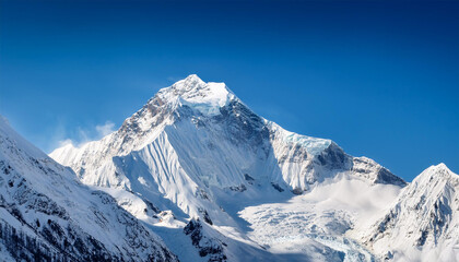 Obraz premium snow covered mountain peak under clear blue sky snow majestic view pristine snow