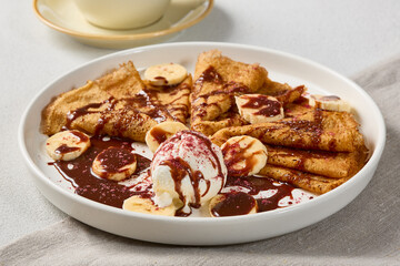 Delicious Banana Chocolate Crepes with Ice Cream A Tempting Dessert in Soft Lighting and Warm Tones