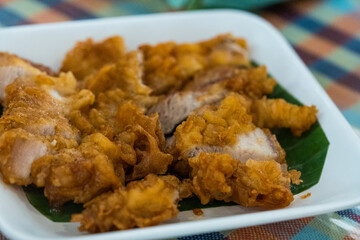 Deep fried pork belly with flour on white dish