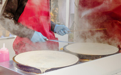 Delicious Crepes Being Made Street Food Man Process , cooking a pancake