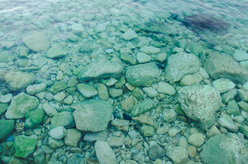 Crystal Clear Water with Smooth Stones under sea water Serene Nature Scene