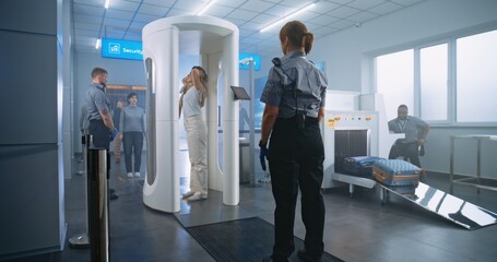 Airport Terminal: Woman Walks Through Metal Detector Gates, Takes Luggage from Conveyor Belt....