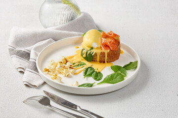 Elegant Brunch Delight Brioche with Salmon, Poached Egg, and Hollandaise Sauce