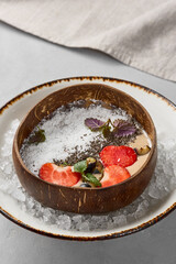 Vibrant Strawberry Banana Smoothie Bowl with Coconut Flakes in Earthy Tones