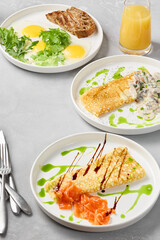 Elegant Breakfast Presentation of Omelets and Fried Eggs with Modern Culinary Artistry