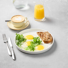 Minimalist Breakfast Sunny-Side Up Eggs with Toast on Subtle Gray Background