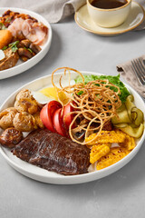 Vibrant Breakfast Combo Featuring Steak, Eggs, Potatoes, and Fresh Veggies in Natural Light