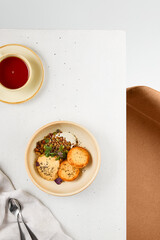 Minimalistic Brunch Scene with Syrniki, Caramel Mousse, and Yogurt Granola