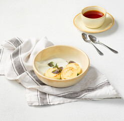 Minimalist Photography of Classic Russian Syrniki with Sour Cream on a Rustic Setting