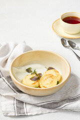 Warm Light Rustic Cuisine Classic Syrniki with Sour Cream in Neutral Tones
