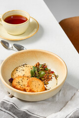 Rustic Breakfast Caramel Mousse Syrniki with Yogurt and Granola in Natural Light