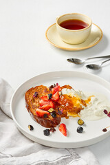 Elegant Breakfast Delight with Fresh Berries and Tea