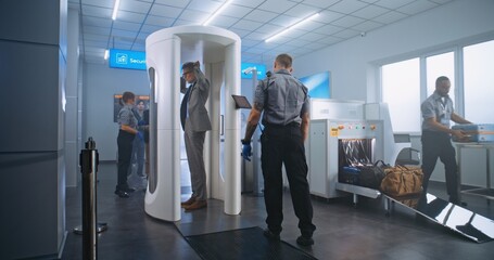 Airport Terminal Checkpoint: Diverse People Walking Through Metal Detector Gates, Taking Luggage...