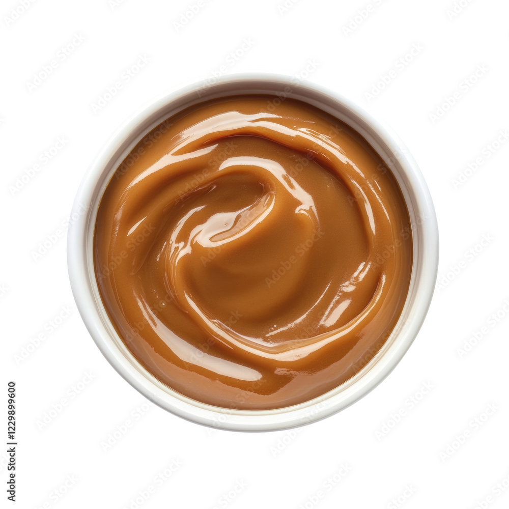 Poster a top view of a small white bowl filled with a swirl of smooth caramel sauce against a black backgro