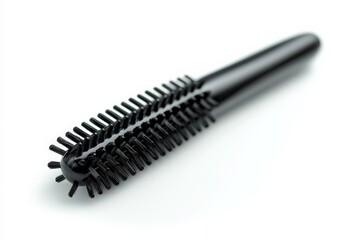 Black grooming tool with dual brushes placed on a white background for hairstyling purposes