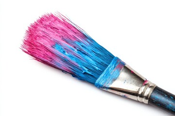 Fototapeta premium Bright paintbrush coated with pink and blue paint rests on a white surface after creative artwork session