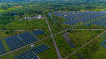 Aerial bird view photo of photovoltaic power station also known as a solar park is large-scale photovoltaic system (PV system) designed for the supply of merchant power into the electricity grid