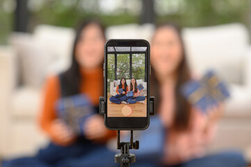 People happily holding gift boxes on New Year's Day and Valentine's Day.