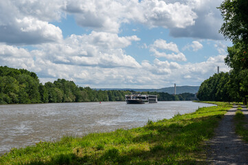 A boat on a river with nature and sky