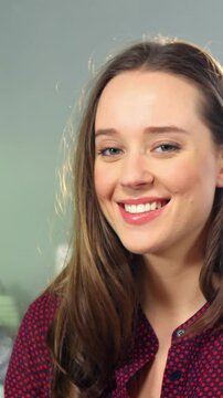 Female staff showing jars of preserves and olive oil on counter