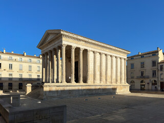 Maison Carree - restored roman temple dedicated to 'princes of youth', with richly decorated columns & friezes in Nimes, France