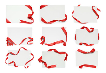 Blank cards with red ribbon isolated on white, top view © New Africa