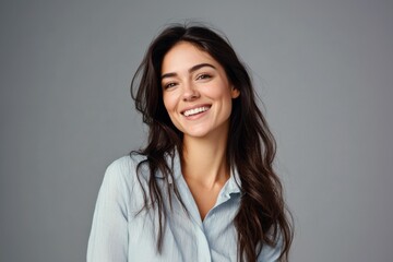 Fototapeta premium attractive woman wearing shirt smiling studio portrait isolated grey background