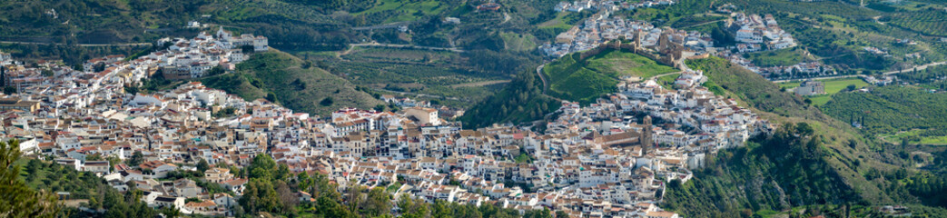 Fototapeta premium Panoramic view from above on the Andalusian white town of Alora, Spain, in a green winter landscape