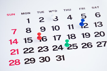 planning with push pin on the calendar