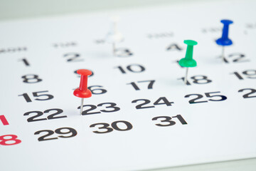 deadline concept with push pin on calendar