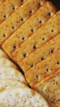 Bowl of green olives, spices, crispy biscuits, jam, rosemary herb, cheese and walnuts